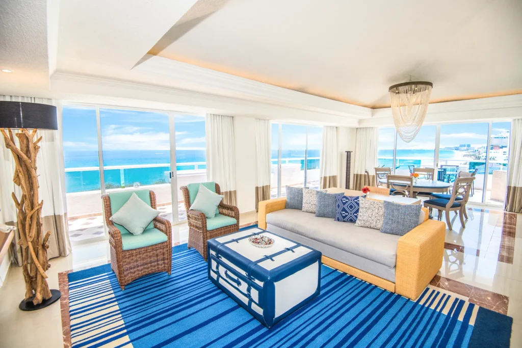 Presidential Suite living area with oceanfront balcony at Sunscape Cancun Resort & Spa.