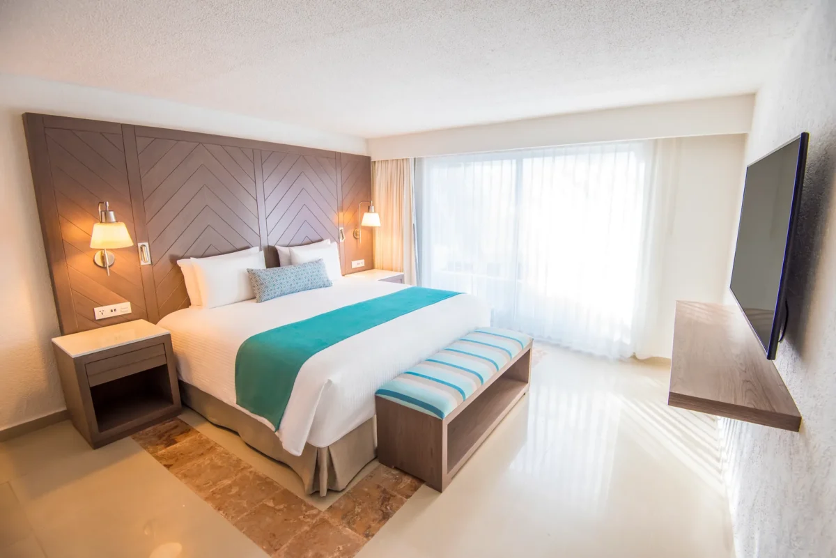 Sun Club One Bedroom Master Suite with king bed and separate living area at Sunscape Cancun Resort & Spa.
