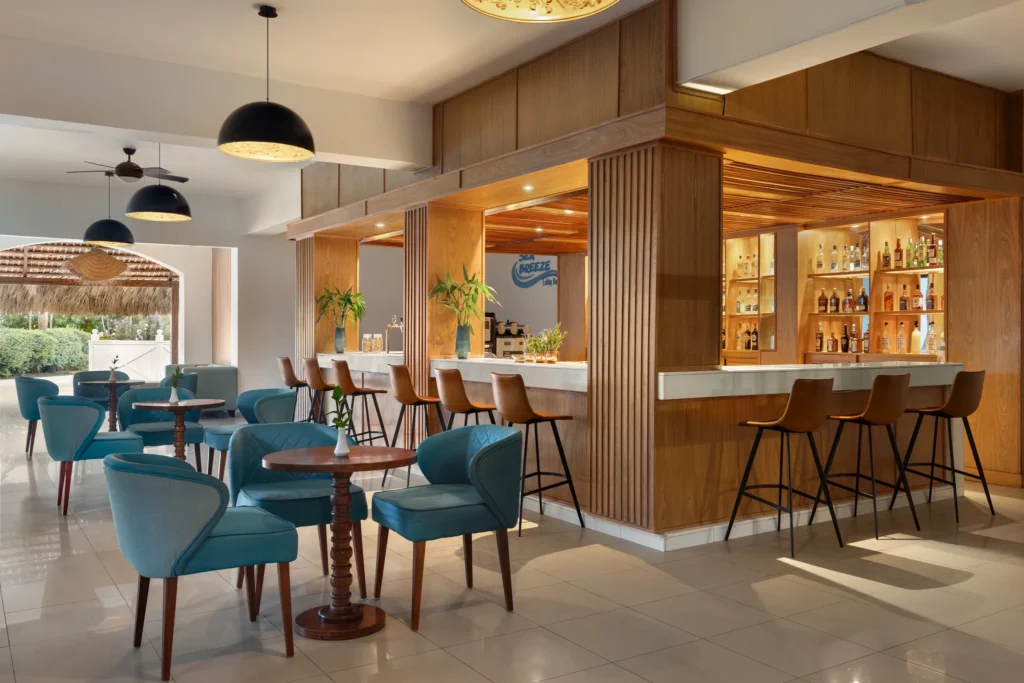 Sea Breeze bar at Sunscape Coco Punta Cana featuring open-air tropical seating, oceanfront views, and refreshing Caribbean cocktails.