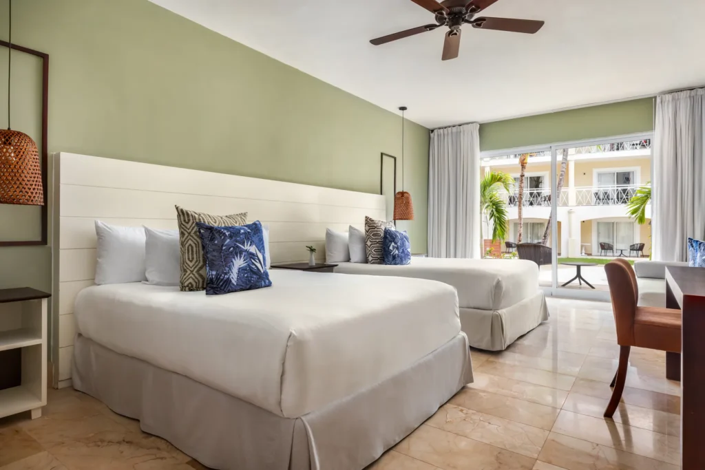 Sun Club Junior Suite Pool Access with two double beds and direct pool access at Sunscape Coco Punta Cana.