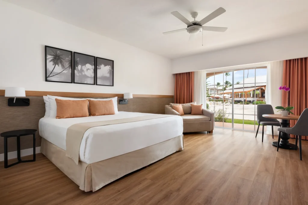 Superior Deluxe Ocean View room with king-size bed and private terrace at Sunscape Coco Punta Cana.