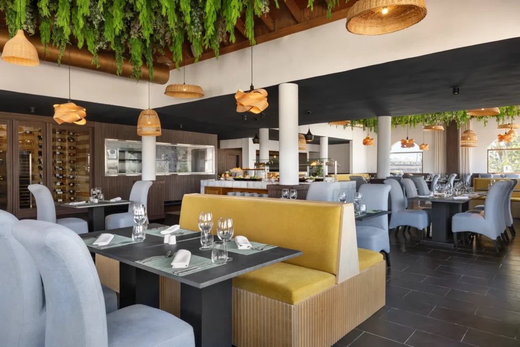 Tierra restaurant at Sunscape Coco Punta Cana featuring rustic Latin-inspired décor, warm lighting, and elegant dining ambiance.