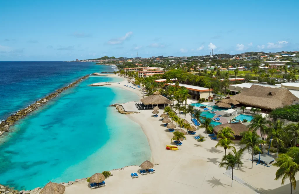 Aerial view of the private beach and turquoise Caribbean waters at Sunscape Curaçao Resort, Spa & Casino.