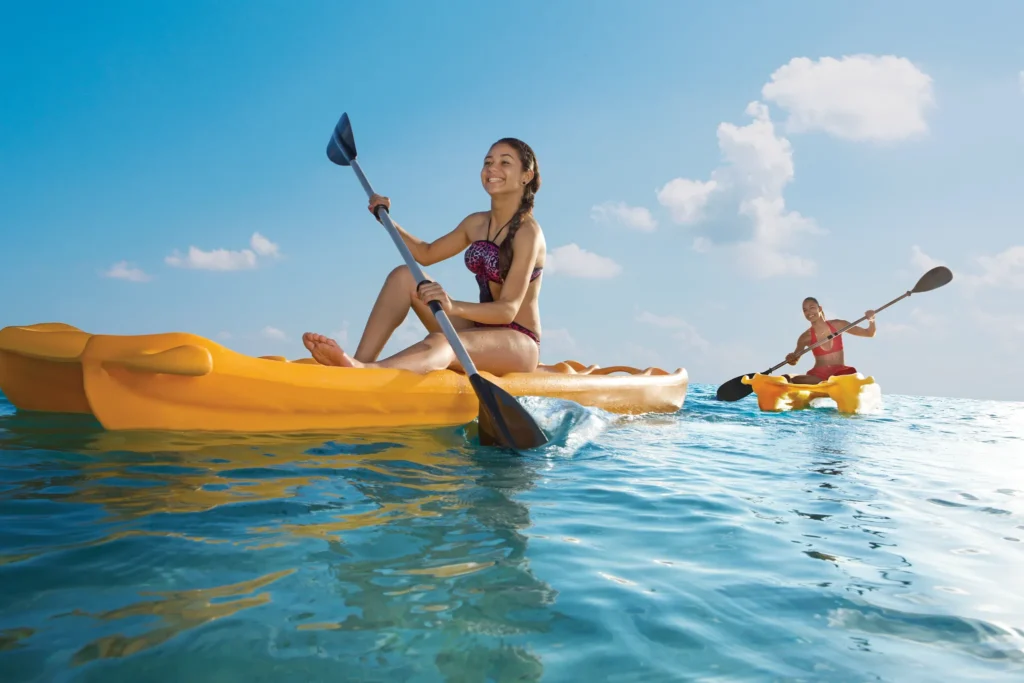 Guests kayaking in the clear Caribbean Sea near Sunscape Curaçao Resort, Spa & Casino.