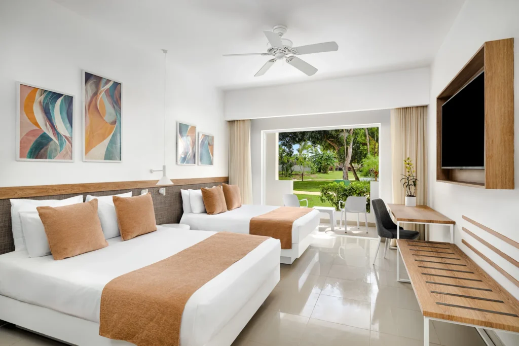 Deluxe Tropical View room with two double beds and garden view balcony at Sunscape Dominicus La Romana.