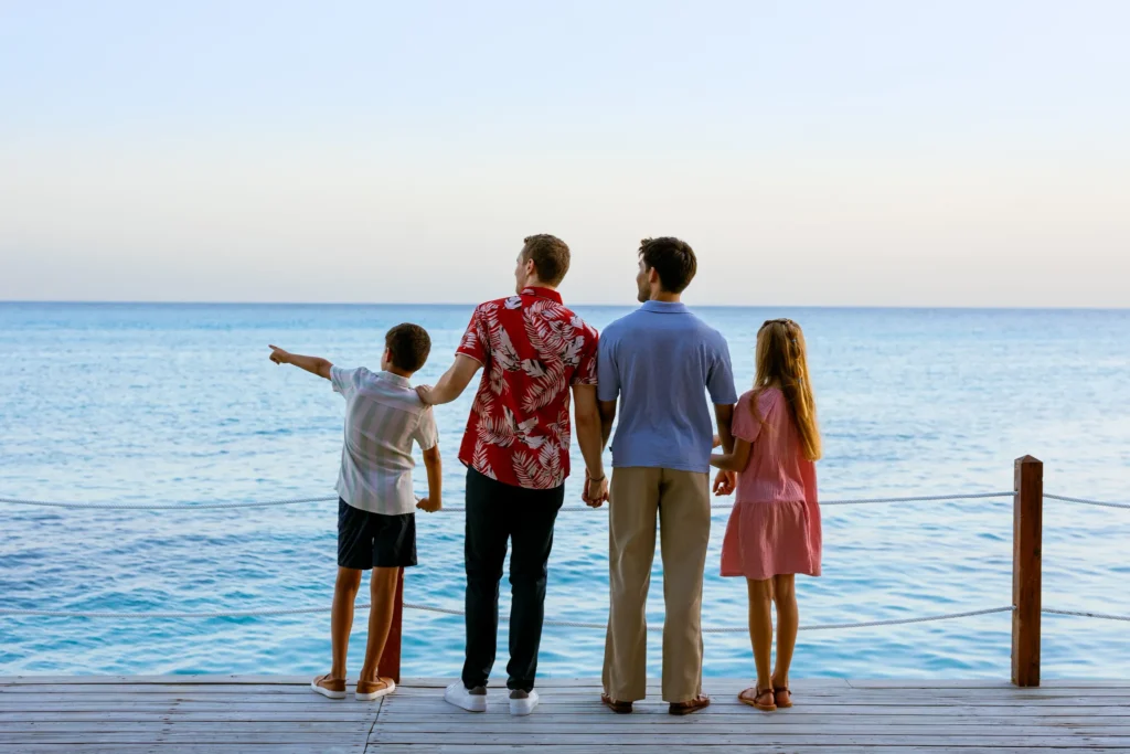 Family admiring ocean views from a seaside deck at Sunscape Dominicus La Romana in the Dominican Republic.