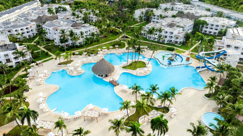 Aerial view of large pool complex with water slides at Sunscape Dominicus La Romana, ideal for families.