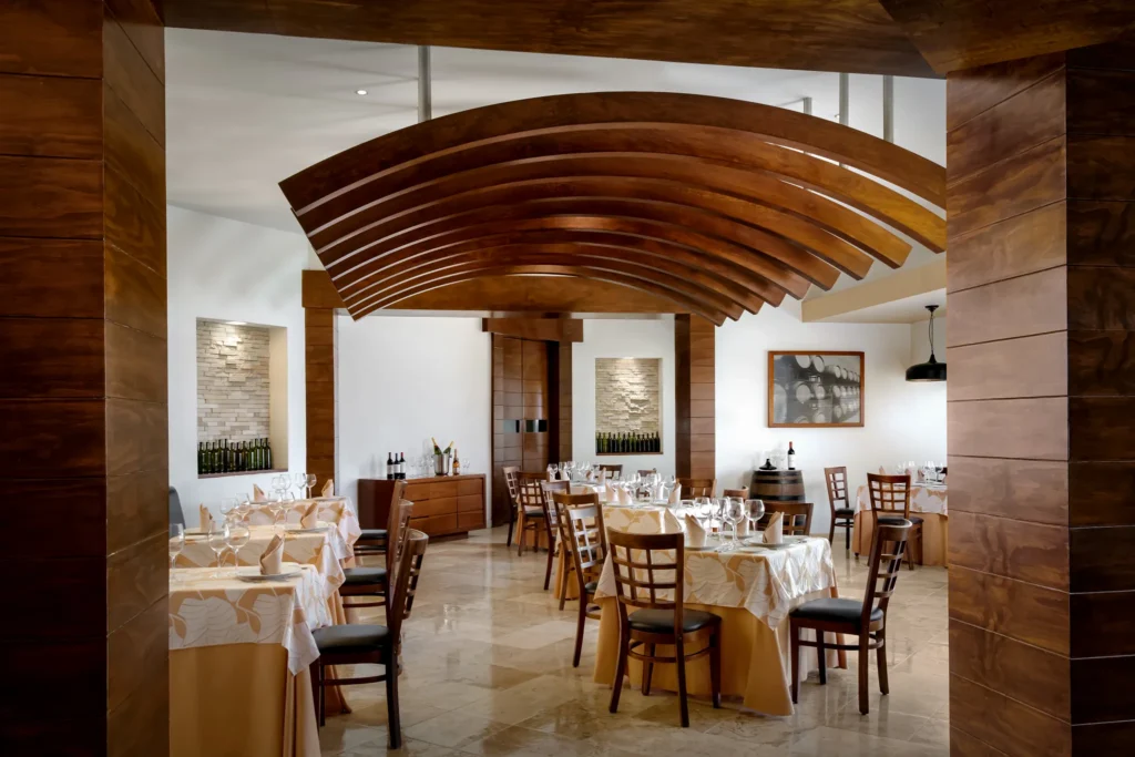 Da Mario Italian restaurant at Sunscape Dorado Pacifico Ixtapa featuring elegant dining tables, warm wood accents, and a refined ambiance.