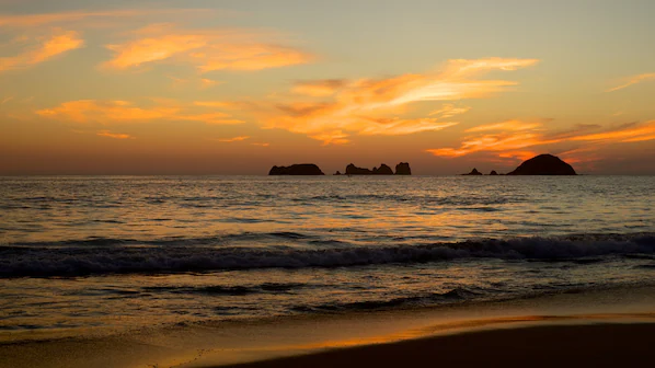 El Palmar Beach at sunset near Sunscape Dorado Pacifico Ixtapa with golden sand and Pacific Ocean views