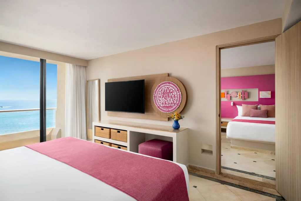 Sun Club Family Connecting suite king bedroom with ocean view balcony at Sunscape Dorado Pacifico Ixtapa.