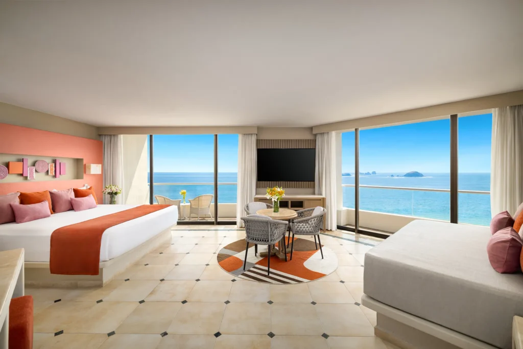 Sun Club Honeymoon Suite king bedroom with dual balconies overlooking the Pacific Ocean at Sunscape Dorado Pacifico Ixtapa.