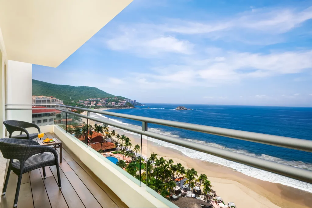 Oceanfront balcony of the Sun Club Presidential Suite overlooking Palmar Bay at Sunscape Dorado Pacifico Ixtapa.