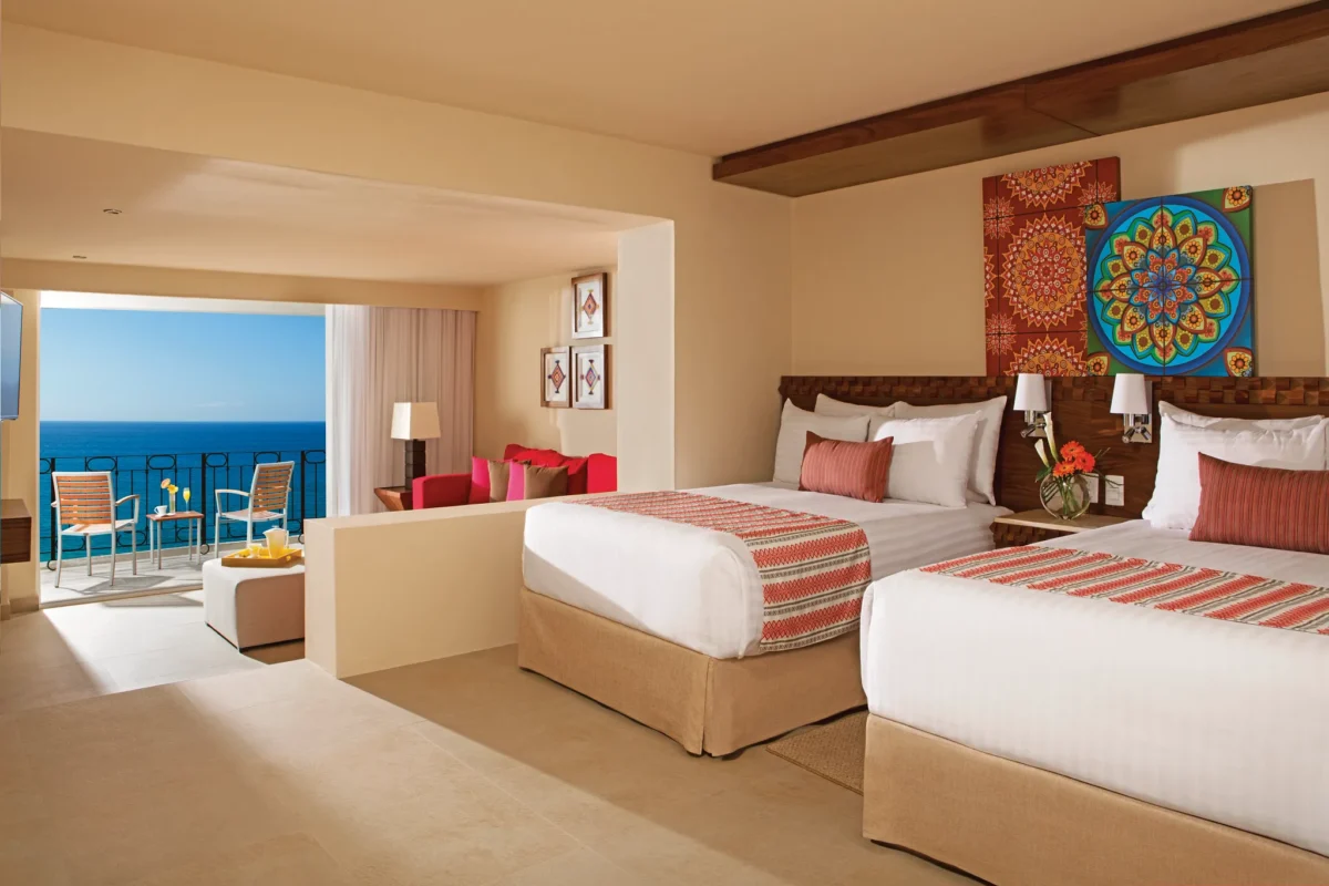 Deluxe Junior Suite Ocean Front View with two double beds and ocean views at Sunscape Puerto Vallarta Resort & Spa.
