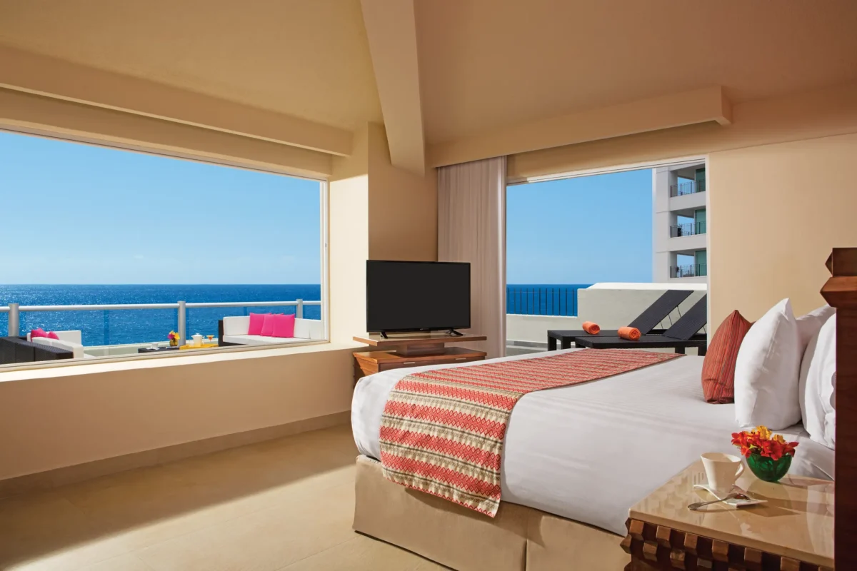 Sun Club Romantic Ocean Front with terrace featuring king bed and panoramic ocean views at Sunscape Puerto Vallarta Resort & Spa.