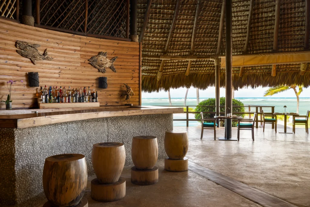 Indigo Bar at Zoëtry Agua Punta Cana featuring a beachfront palapa bar with ocean views and handcrafted tropical cocktails.