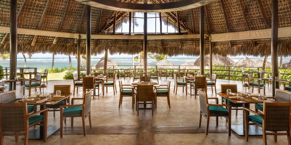 Open-air Indigo Restaurant reception venue with ocean views at Zoetry Agua Punta Cana
