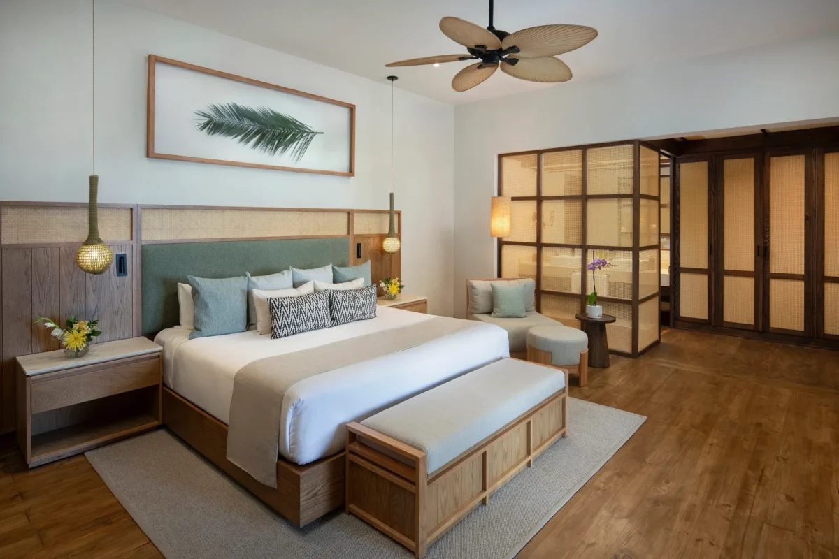Romantic Junior Suite Agua Swim Up king bedroom with terrace access at Zoëtry Agua Punta Cana.