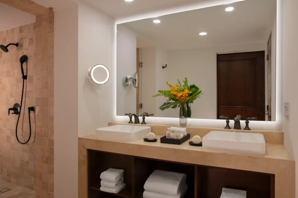 Deluxe Partial Ocean View bathroom with double vanity and rain shower at Zoëtry Casa del Mar Los Cabos.