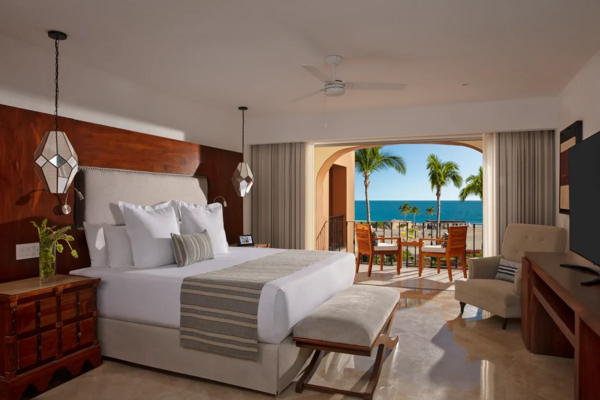 Luxury One Bedroom Suite ocean view bedroom with king bed and private balcony at Zoëtry Casa del Mar Los Cabos.