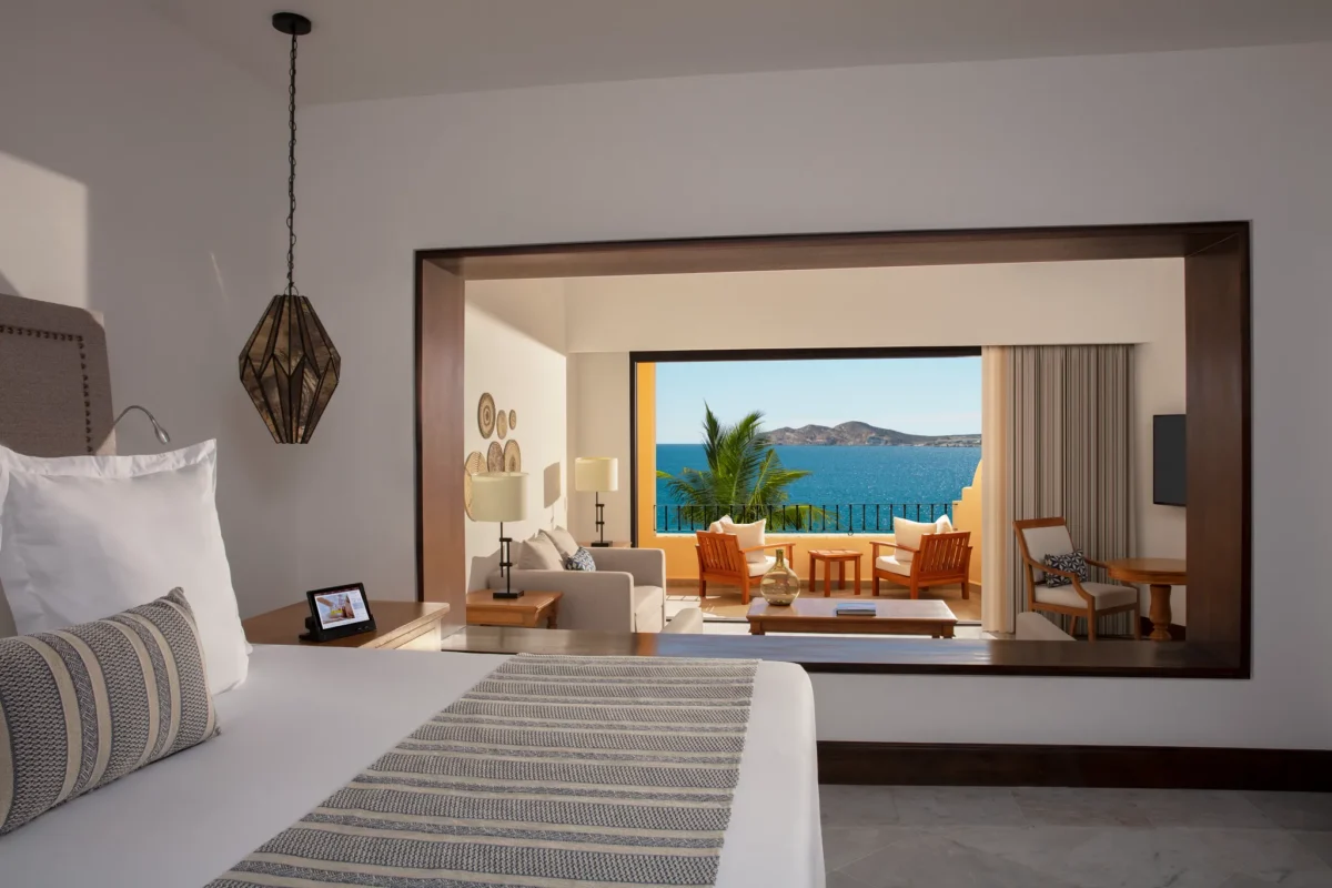 Master One Bedroom Suite partial ocean view bedroom with king bed and terrace at Zoëtry Casa del Mar Los Cabos.