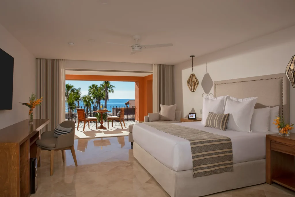 One Bedroom Suite ocean view bedroom with king bed and private terrace at Zoëtry Casa del Mar Los Cabos.