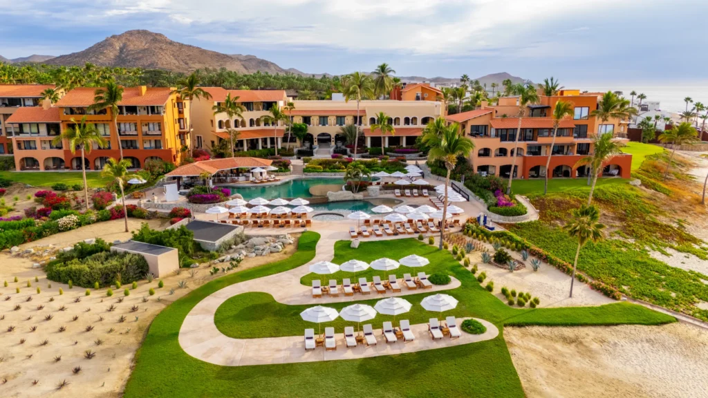 Aerial view of Zoëtry Casa del Mar Los Cabos with pool, beachfront, and terracotta buildings along the Sea of Cortez.