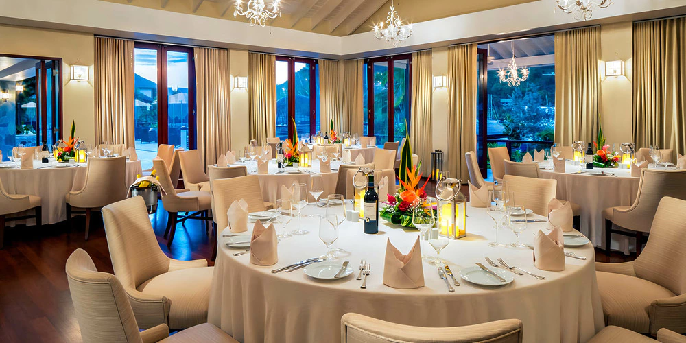 Elegant indoor wedding reception setup at The Boudreau Room at Zoetry Marigot Bay St. Lucia