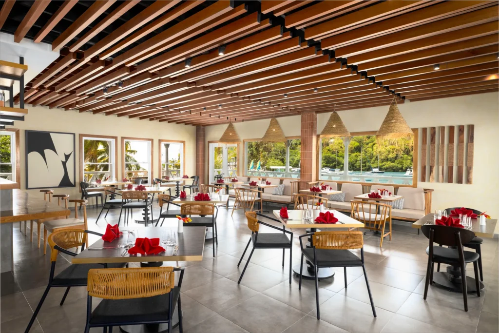 Driftwood Steakhouse & Seafood at Zoëtry Marigot Bay St. Lucia featuring elegant marina-view dining and contemporary Caribbean-inspired décor.