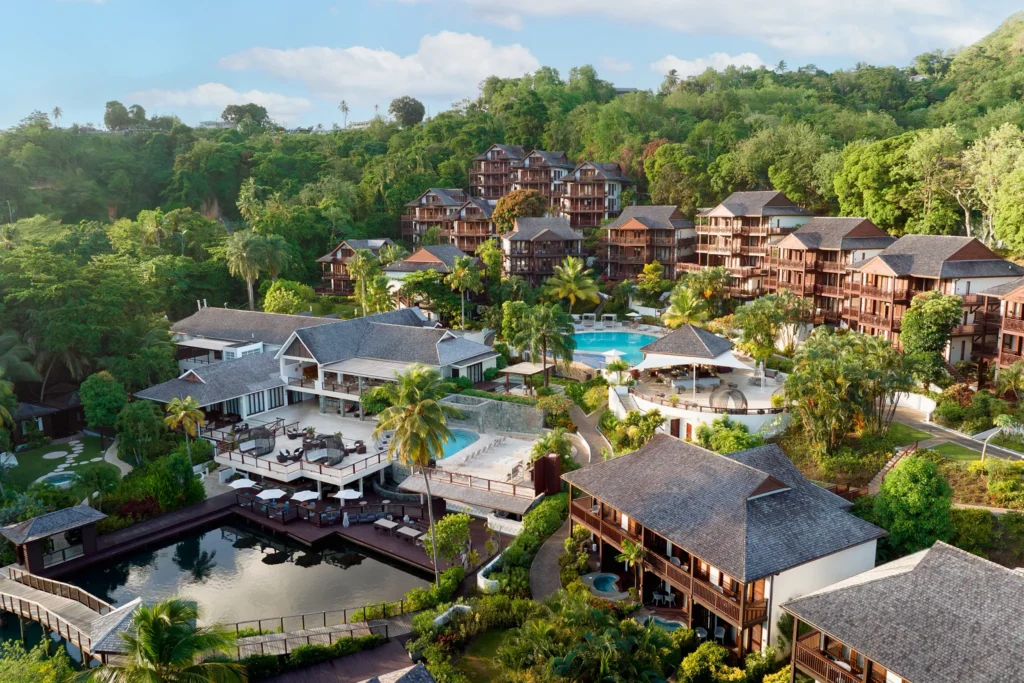Zoëtry Marigot Bay St. Lucia overlooking calm turquoise waters and hillside villas surrounded by lush greenery.