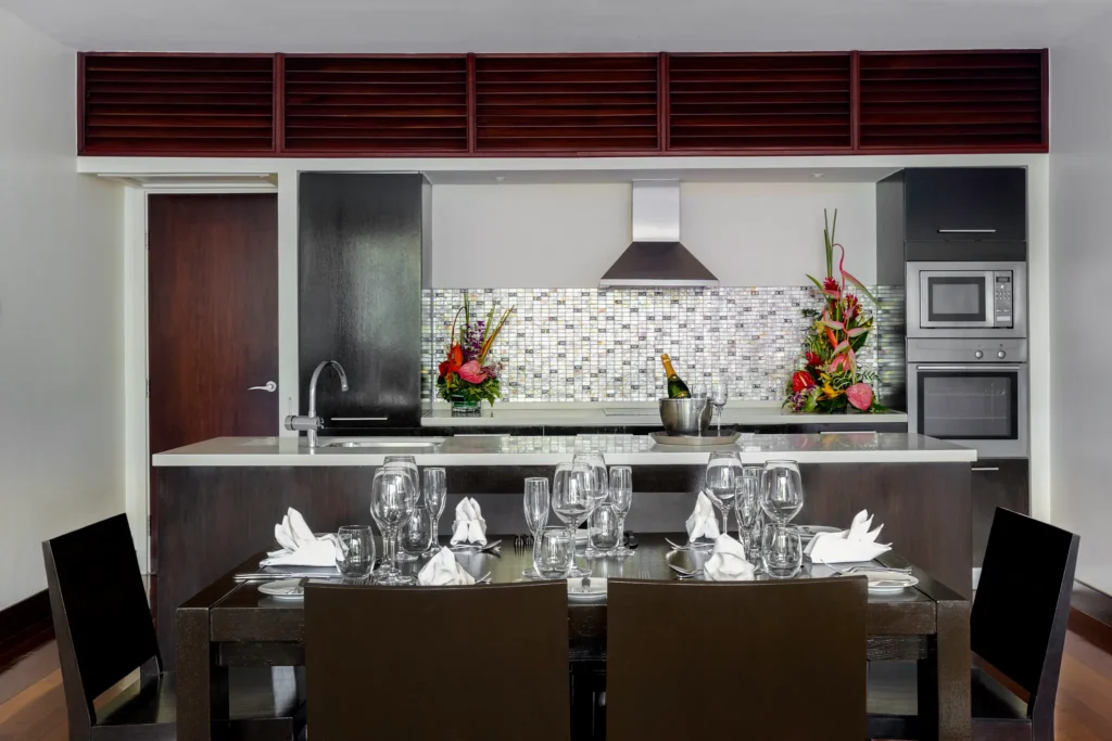 Well-appointed kitchen and dining area inside Master Suite Residence at Zoëtry Marigot Bay.