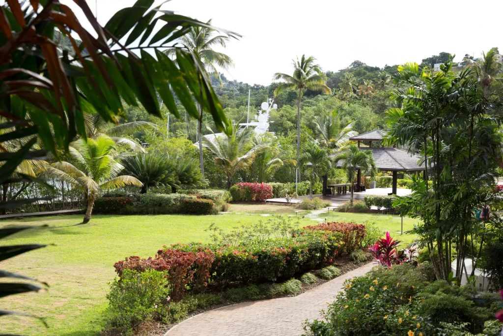 Lush tropical garden with pavilion and palm trees at Zoëtry Marigot Bay St. Lucia.