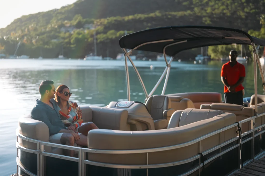Couple relaxing on a pontoon boat ride in Marigot Bay near Zoëtry Marigot Bay St. Lucia.