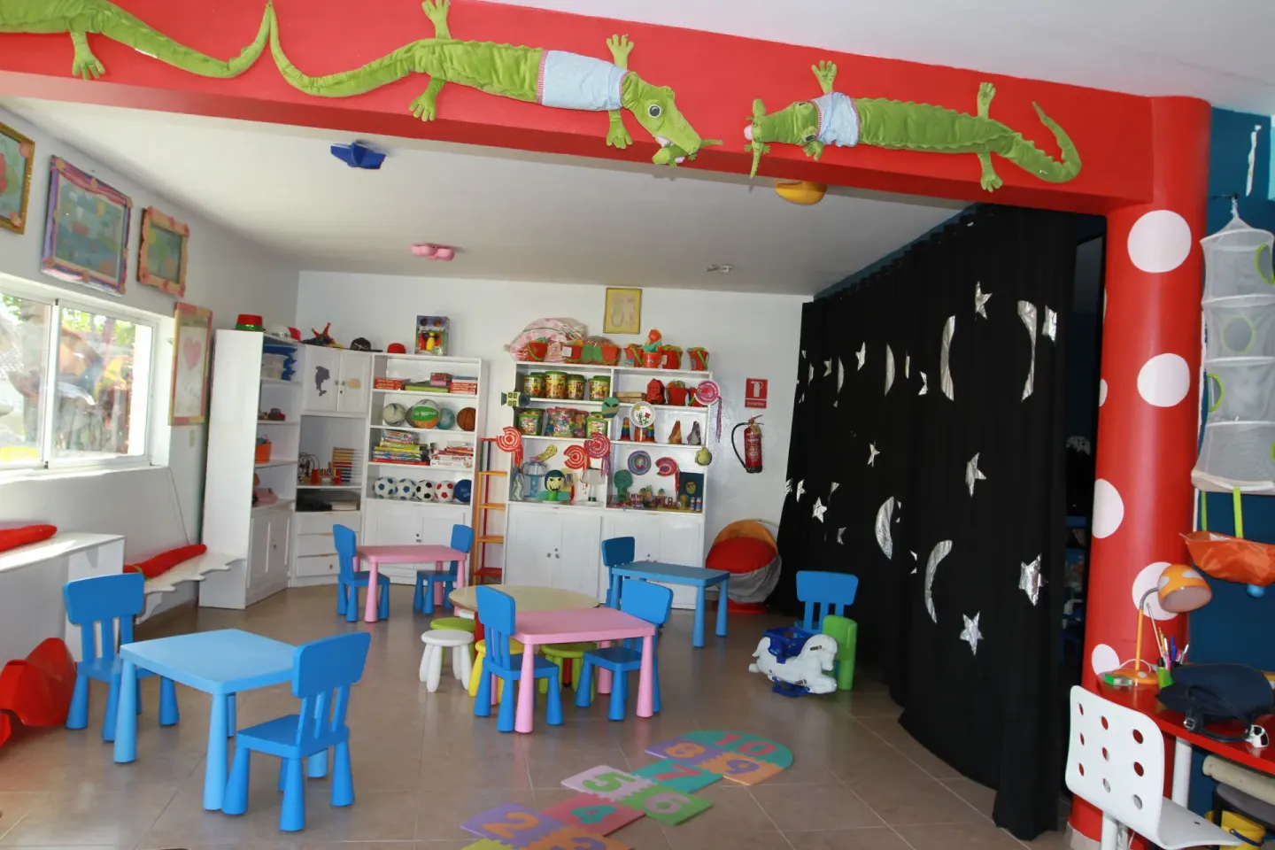 A colorful children's playroom with small tables at Lifestyle Tropical Beach Resort & Spa.