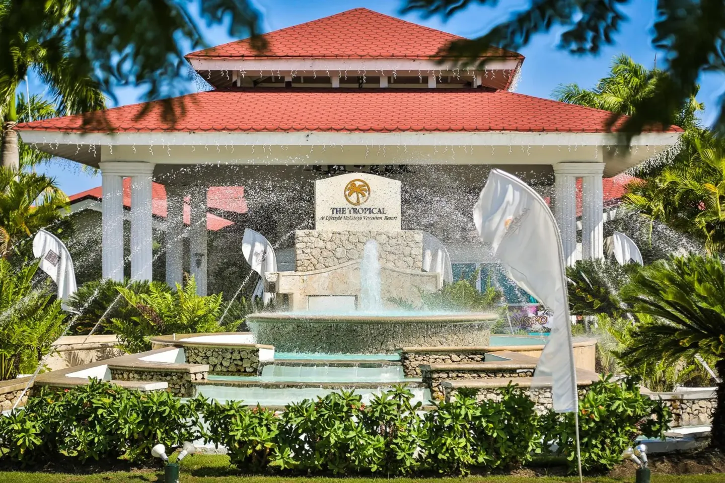 Entrance fountain and red-roof pavilion at Lifestyle Tropical Beach Resort & Spa.