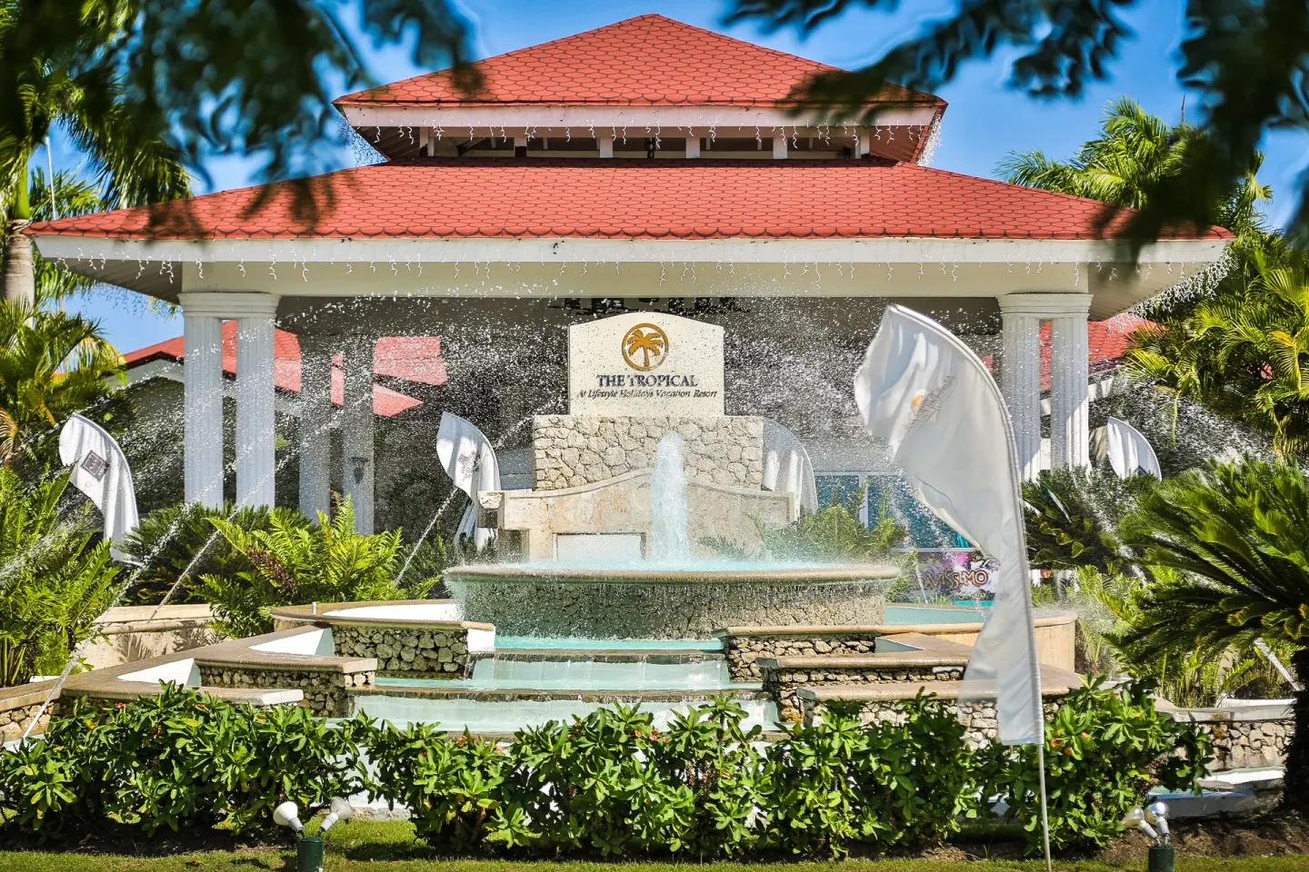 Entrance fountain and red-roofed pavilion at Lifestyle Tropical Beach Resort & Spa.