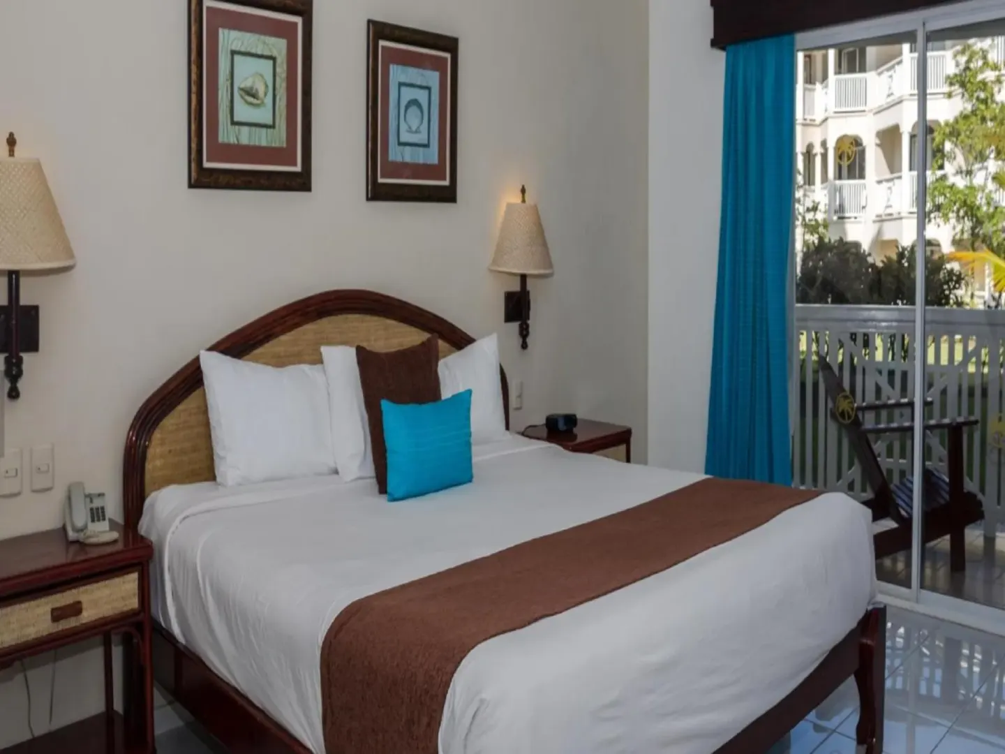 Guest room with a double bed and balcony at Lifestyle Tropical Beach Resort & Spa.