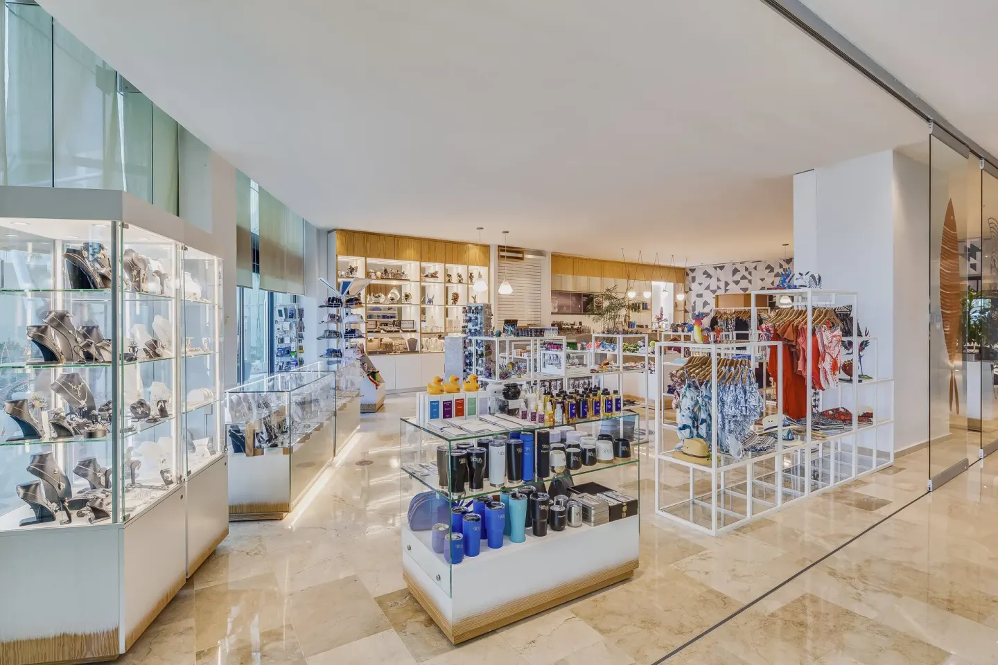 Resort boutique with display cases, clothing racks, and gifts at Live Aqua Cancun.