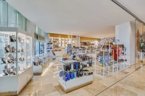 Resort boutique with display cases, clothing racks, and gifts at Live Aqua Cancun.