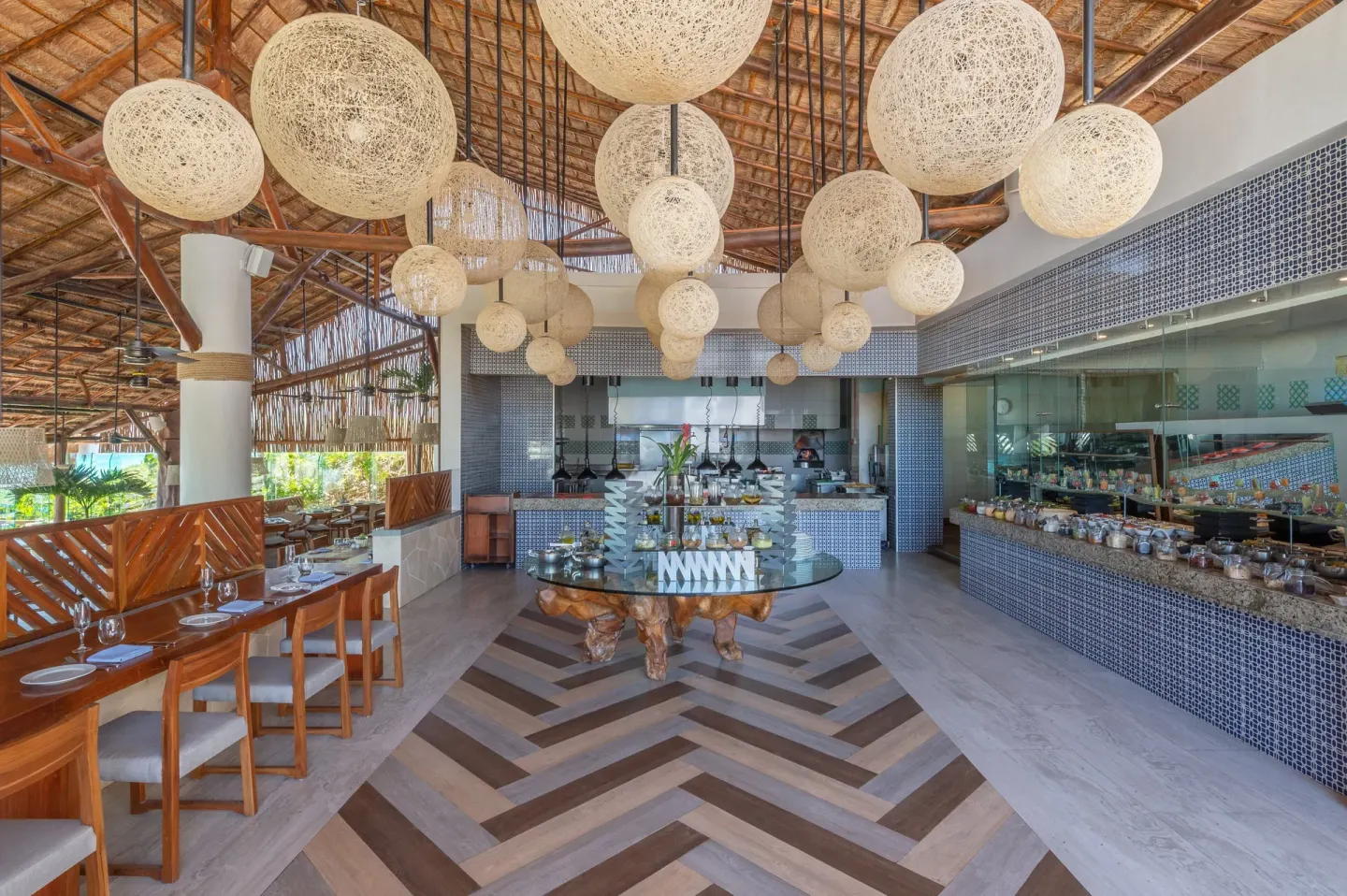 Buffet restaurant interior with woven globe lights at Live Aqua Cancun.