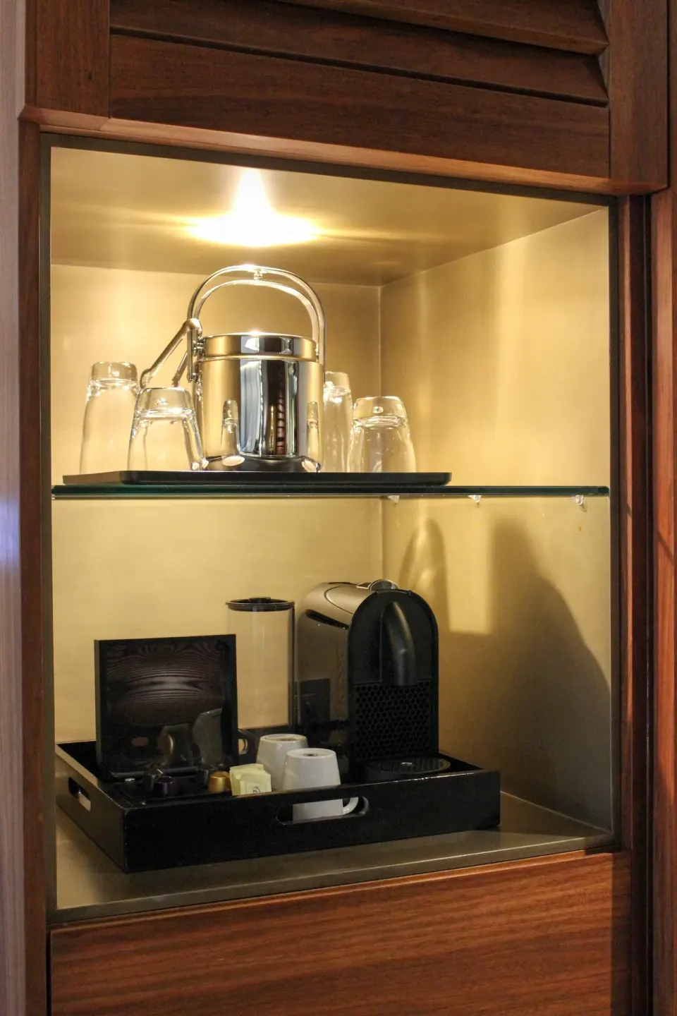 In-room coffee and glassware cabinet in a Premium Room at Live Aqua Cancun.