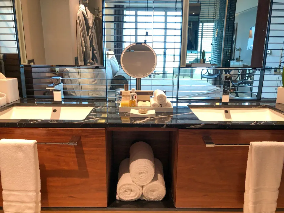 Premium Room double-sink bathroom vanity with towels at Live Aqua Cancun.