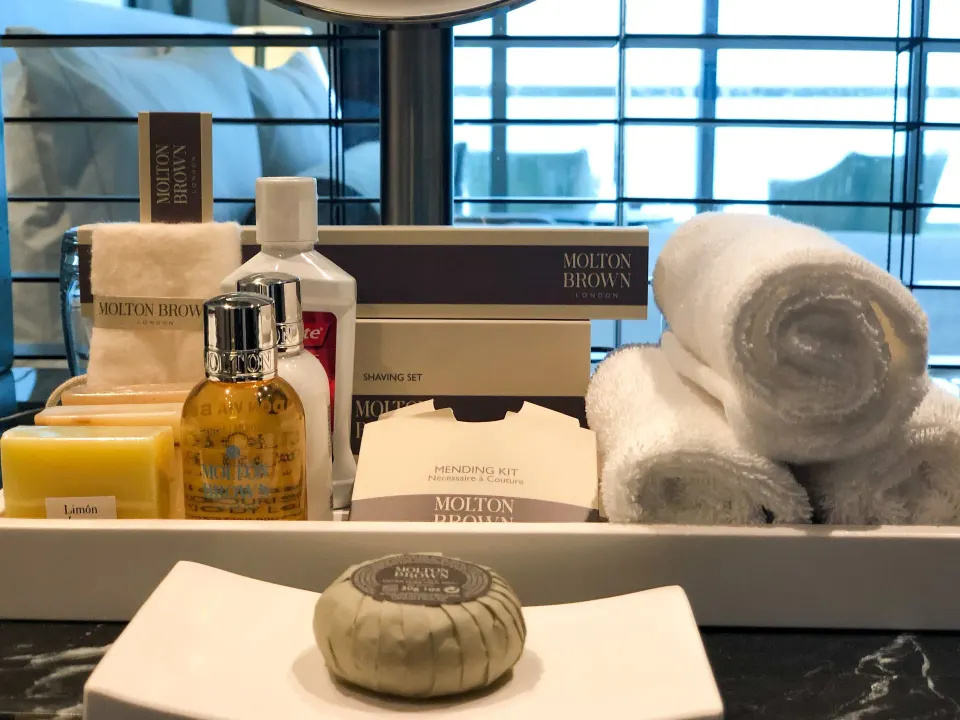 Premium Room bath amenities and rolled towels on a vanity at Live Aqua Cancun.