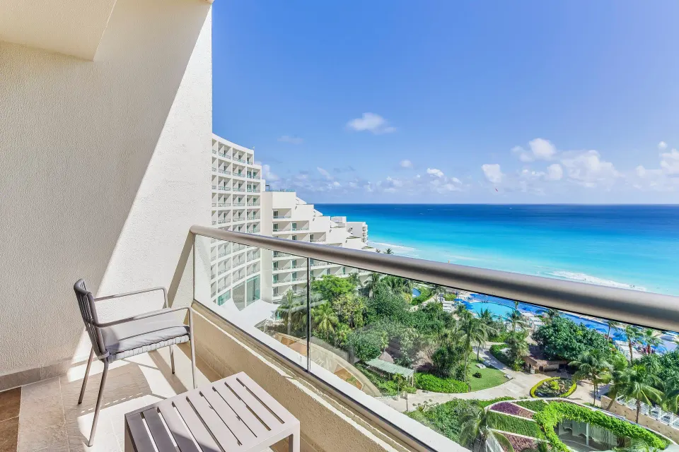 Premium room balcony with chair and ocean view at Live Aqua Cancun.