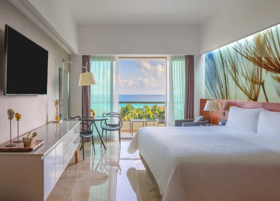 Premium ocean-view king room with palm and sea view at Live Aqua Cancun.