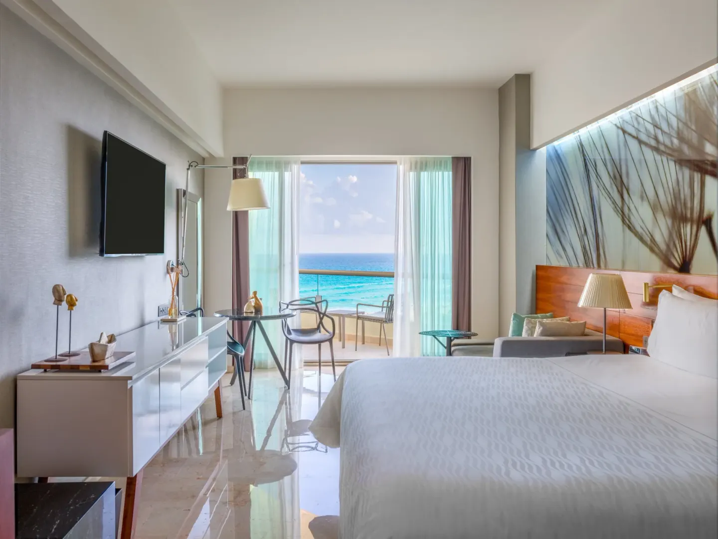 Premium ocean-view king room with TV and balcony at Live Aqua Cancun.