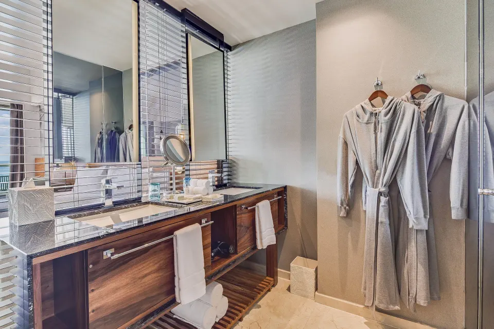 Premium Room bathroom vanity with robes at Live Aqua Cancun.