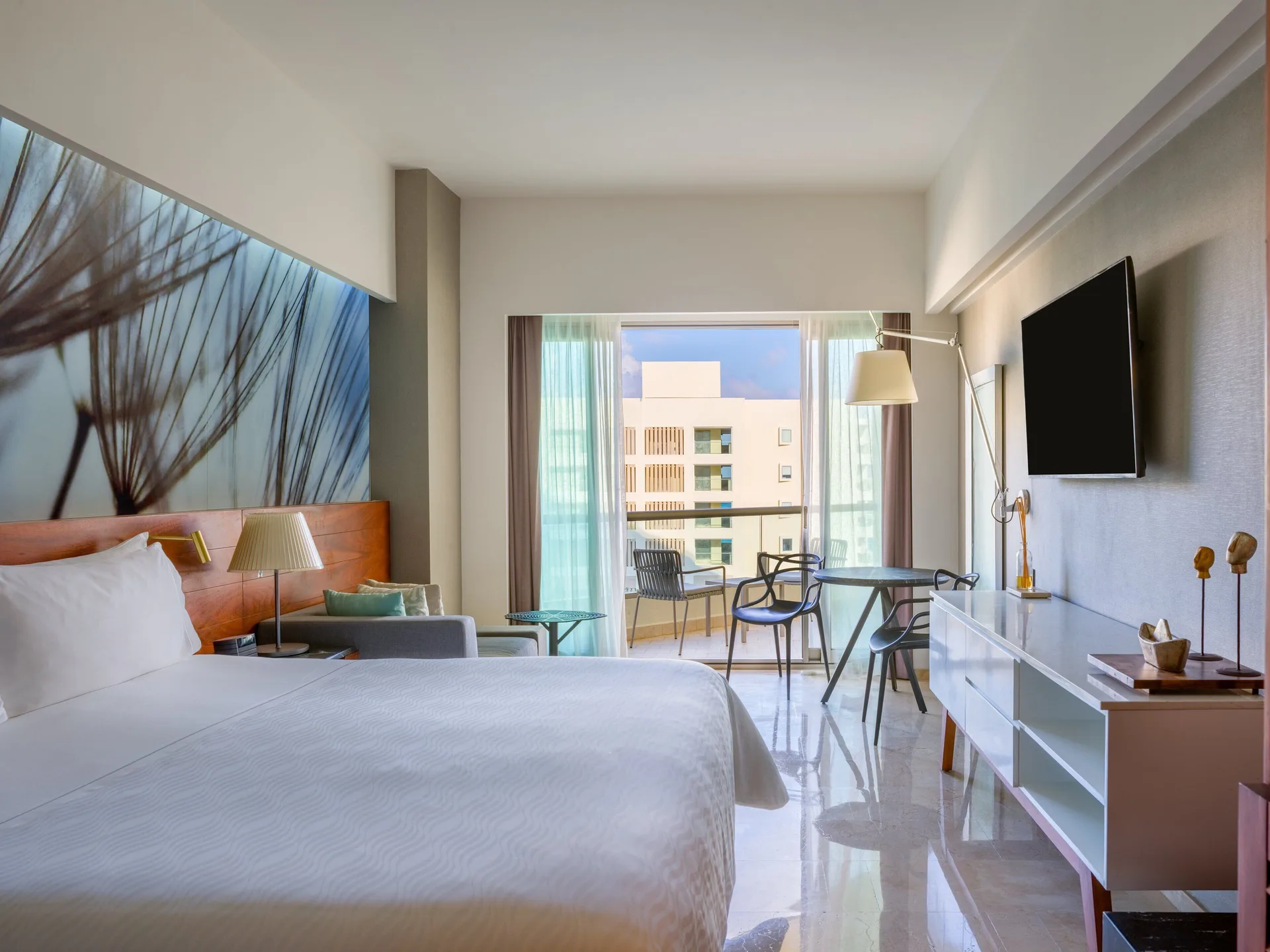 Premium Room Partial Ocean View at Live Aqua Cancun with king bed, private balcony, and partial ocean views in Cancun's Hotel Zone.