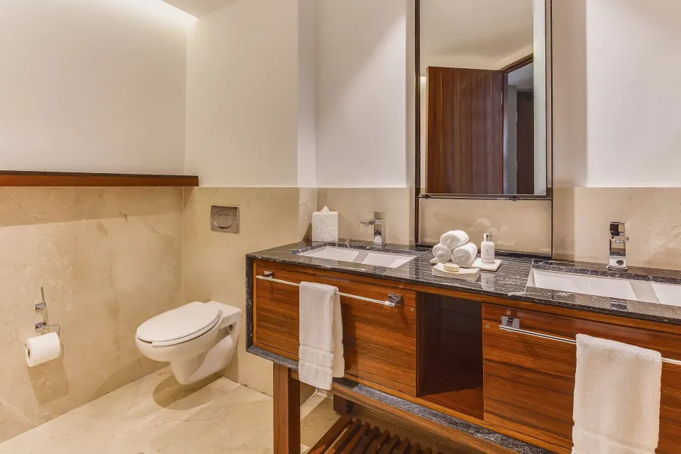 Suite Tierra bathroom with double vanity and toilet at Live Aqua Cancun.