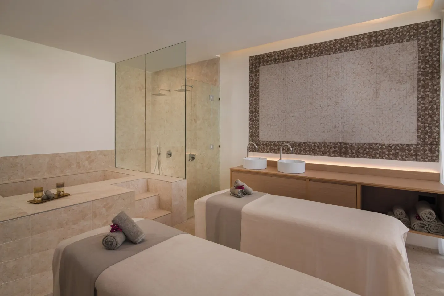 Spa room with two treatment beds, soaking tub, and double sinks at Live Aqua Punta Cana.