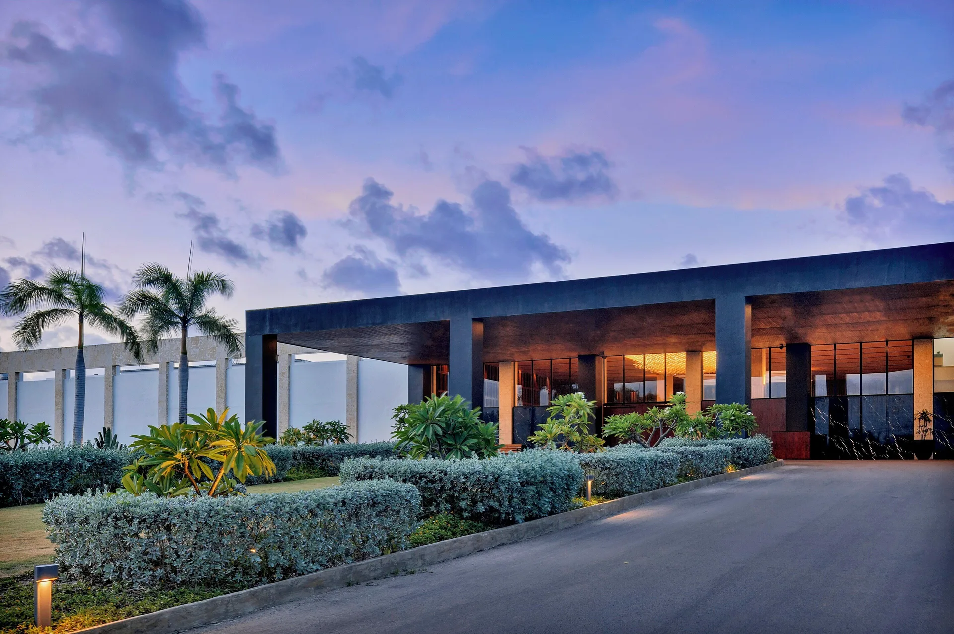 Evening view of the lobby entrance and gardens at Live Aqua Punta Cana.